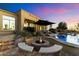 Outdoor patio showcasing a pool, a fire pit and comfortable seating at 37080 N 109Th Way, Scottsdale, AZ 85262