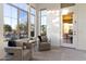 Cozy sitting area with large windows offering a view of the outdoor pool at 37080 N 109Th Way, Scottsdale, AZ 85262