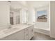 Modern bathroom boasts dual sinks, large mirror, and a separate shower, and bath at 37093 W La Paz St, Maricopa, AZ 85138