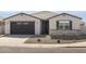 Charming single-story home with a two-car garage and desert landscaping at 37093 W La Paz St, Maricopa, AZ 85138