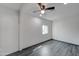 Bright bedroom featuring a ceiling fan and gray floors, offering a simple and comfortable space at 3714 E Polk St, Phoenix, AZ 85008