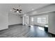 Bright open-concept living room features wood-look floors and recessed lighting at 3714 E Polk St, Phoenix, AZ 85008