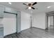 Bright and airy living room with modern flooring and a ceiling fan at 3714 E Polk St, Phoenix, AZ 85008