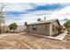 View of the backyard featuring a block fence, trees, and landscaping at 398 W Elgin St, Chandler, AZ 85225