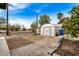 Backyard area featuring a storage shed, block fence, and mature trees at 398 W Elgin St, Chandler, AZ 85225