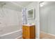 Bathroom featuring tub, shower, single sink vanity, and updated fixtures at 398 W Elgin St, Chandler, AZ 85225