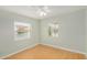 Cozy bedroom with two windows and a ceiling fan, filling the space with plenty of natural light at 398 W Elgin St, Chandler, AZ 85225