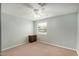 Bright bedroom with neutral walls, ceiling fan, carpet, and a window offering natural light at 398 W Elgin St, Chandler, AZ 85225