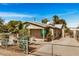 Charming single-story home with fenced yard and desert landscaping under a beautiful blue sky at 398 W Elgin St, Chandler, AZ 85225