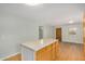 Kitchen island with light countertop and storage, and stainless steel appliances in an open floor plan at 398 W Elgin St, Chandler, AZ 85225