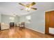 Cozy living room featuring wood-look floors, a ceiling fan, and neutral colored furniture and walls at 398 W Elgin St, Chandler, AZ 85225