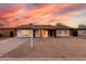 Charming single-story home featuring a well-maintained front yard and a classic ranch-style architecture at 4052 W Eva St, Phoenix, AZ 85051