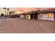 Beautiful single-story house with desert landscaping, accented by the glow of warm interior lighting at 4052 W Eva St, Phoenix, AZ 85051