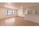 Room with a neutral palette, built-in cabinets, and ample natural light from a nearby window at 4052 W Eva St, Phoenix, AZ 85051