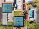 An aerial perspective of community amenities includes tennis courts, a pool, and lush landscaping, promoting an active lifestyle at 4662 E Escondido Ave, Mesa, AZ 85206