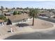 Expansive aerial view showcases the home's tidy landscaping, neighborhood, and adjacent street at 4662 E Escondido Ave, Mesa, AZ 85206