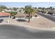 An elevated view of a single-story home showcasing its landscaping, neighborhood setting, and surrounding street at 4662 E Escondido Ave, Mesa, AZ 85206