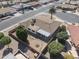 An aerial shot of this home shows the fenced backyard, desert landscape, and convenient location in a quiet neighborhood at 4662 E Escondido Ave, Mesa, AZ 85206