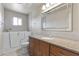 Modern bathroom with a walk-in bathtub, vanity with granite countertop, and a large mirror at 4662 E Escondido Ave, Mesa, AZ 85206