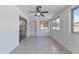 Bright dining room with tiled floor, sliding glass doors, and multiple windows at 4662 E Escondido Ave, Mesa, AZ 85206