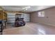 A clean garage featuring a golf cart, ample storage space, and a well-lit environment for any hobbyist or homeowner at 4662 E Escondido Ave, Mesa, AZ 85206