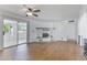 Bright living room featuring a fireplace, sliding glass doors, and wood-look tile flooring at 4662 E Escondido Ave, Mesa, AZ 85206