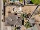 Aerial view of the property showcasing the expansive backyard with a pool and mature trees at 4702 E Monte Cristo Ave, Phoenix, AZ 85032