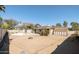 Spacious backyard with a large pool, a fire pit, and ample space for entertaining at 4702 E Monte Cristo Ave, Phoenix, AZ 85032