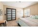 Comfortable bedroom featuring a sliding door closet, and a shuttered window allowing natural light at 4702 E Monte Cristo Ave, Phoenix, AZ 85032