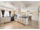 Bright kitchen featuring modern appliances, wooden cabinetry, tile flooring, and a seamless transition into dining area at 4702 E Monte Cristo Ave, Phoenix, AZ 85032