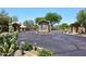 Community entrance gate with desert landscaping and mature trees offers security and curb appeal at 4733 E Morning Vista Ln, Cave Creek, AZ 85331