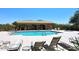 Resort-style community pool with lounge chairs, shade structure, and clear blue water for relaxation at 4733 E Morning Vista Ln, Cave Creek, AZ 85331