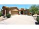 Charming home featuring a spacious driveway, two-car garage, and well-maintained landscaping with desert plants at 4733 E Morning Vista Ln, Cave Creek, AZ 85331