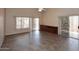 Spacious living room with tile flooring, large windows, and patio access at 4733 E Morning Vista Ln, Cave Creek, AZ 85331