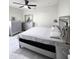 Bright bedroom with mirrored furniture, a ceiling fan, and white walls at 5259 W Village Dr, Glendale, AZ 85308