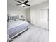 Bright bedroom with white walls, ceiling fan, and a mirrored bed frame at 5259 W Village Dr, Glendale, AZ 85308