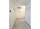 Bright hallway with white doors and tiled floor at 5259 W Village Dr, Glendale, AZ 85308