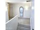 Hallway with a decorative mirror, tiled floor, and lighting at 5259 W Village Dr, Glendale, AZ 85308