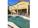 The pool is surrounded by a fence and features a patio area for lounging at 5259 W Village Dr, Glendale, AZ 85308