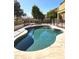 Relaxing pool with landscaped trees and an outdoor grill at 5259 W Village Dr, Glendale, AZ 85308