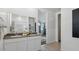 Bathroom featuring double vanity, large mirror, and ample lighting at 5573 E Rock Bush Ln, San Tan Valley, AZ 85140