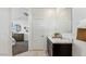 Bathroom featuring single vanity and mirror with a view into the main bedroom at 5573 E Rock Bush Ln, San Tan Valley, AZ 85140