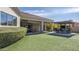 Outdoor living area with a built-in grill, a seating area and a lush lawn at 56 S Prairie Rd, Gilbert, AZ 85296