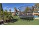 Spacious backyard featuring a trampoline, playhouse, and sport court, perfect for outdoor fun at 56 S Prairie Rd, Gilbert, AZ 85296