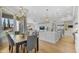 Inviting dining room with open-concept layout featuring large windows and modern lighting at 56 S Prairie Rd, Gilbert, AZ 85296