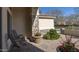 Covered porch area with stone pillars and a beautifully landscaped front yard at 56 S Prairie Rd, Gilbert, AZ 85296