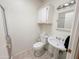 Bathroom features a pedestal sink, toilet, storage, and a shower with glass doors at 5735 E Mcdowell Rd # 447, Mesa, AZ 85215