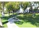 Community park with walking paths, mature trees, and seating areas, perfect for outdoor activities and relaxation at 5735 E Mcdowell Rd # 447, Mesa, AZ 85215