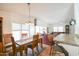 Cozy dining area connected to living spaces, featuring natural light and bar-style seating at kitchen at 5735 E Mcdowell Rd # 447, Mesa, AZ 85215