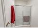 Shower with glass doors is equipped with towel hooks and a shower rack at 5735 E Mcdowell Rd # 447, Mesa, AZ 85215